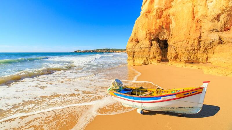 Portugal: the Algarve has dramatic cliffs and golden sandy beaches. Photograph: Getty