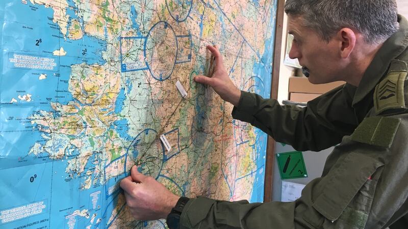 Sgt Damien Kelly plots a heading (flight direction). Photograph: Peter Murtagh