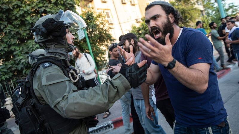 Israeli riot police tries to block a Jewish right-wing man as clashes erupted between Arabs, police and Jews, in the mixed town of Lod on Wednesday. Photograph:  Heidi Levine/AP