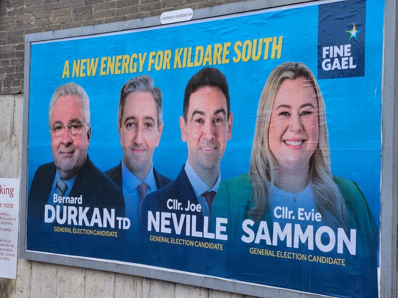 Surprise: Simon Harris beams behind Kildare North candidates Joe Neville, Evie Sammon and Bernard Durkan on posters for Kildare South 