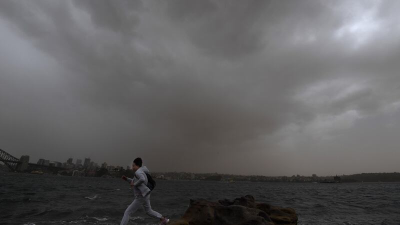 A  dust storm that has swept across drought-stricken parts of New South Wales has shrouded Sydney’s landmarks and sparked an air quality warning from the State Government. Photograph: Dean Lesins/EPA