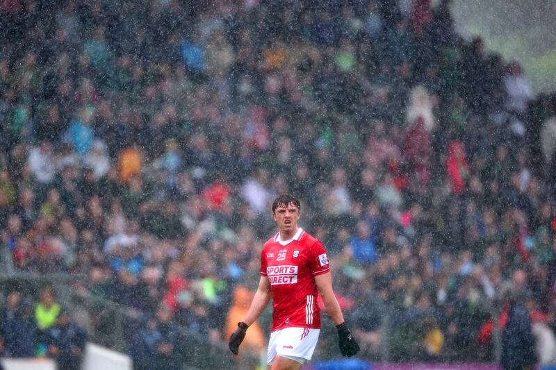 Cork's Éanna O'Hanlon looks on as the wet weather conditions set in during the game against Meath. Photograph: ©INPHO/Ben Brady