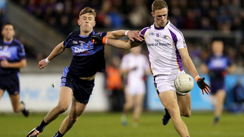 Kilmacud Crokes’ Paul Mannion is challenged by  Tom Lahiff of St Jude’s during the Dublin SFC Final at Parnell Park. Photograph:  Laszlo Geczo/Inpho