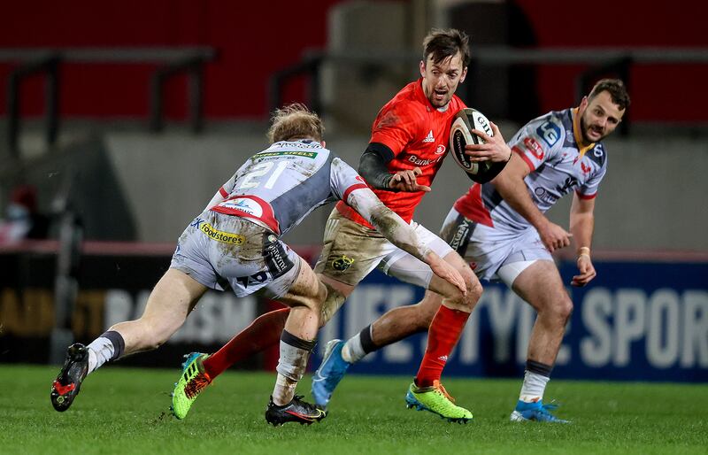 Scarlets' Will Homer tackles Munster's Darren Sweetnam at Thomond Park. Sweetnam was the one that Cork GAA desperately didn’t want to lose. At elite level, though, the rate of attrition has been tiny. Photograph: Bryan Keane/Inpho 