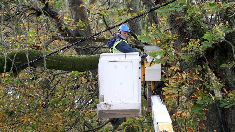 An ESB worker checking a line hit by a fallen tree at Salthill, Galway, during the storm. Photograph: Joe O’Shaughnessy