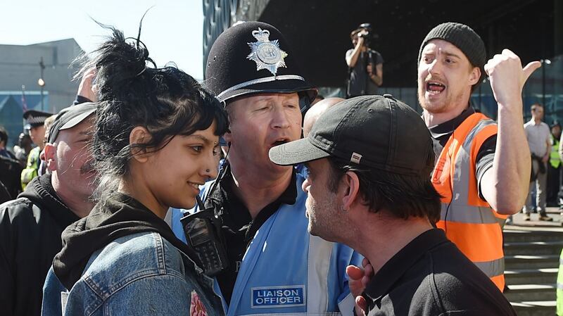 Saffiyah Khan staring down   English Defence League  protester Ian Crossland during a demonstration in Birmingham.  Photograph: Joe Giddens/PA