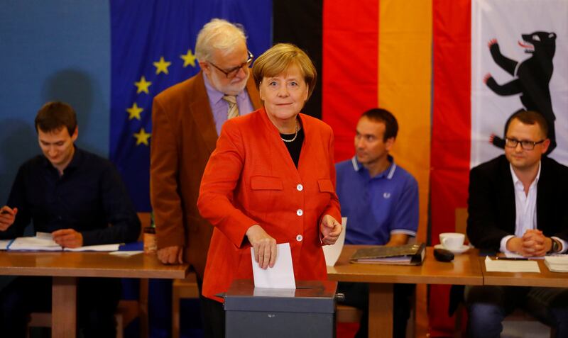 German chancellor and leader of the Christian Democratic Union Angela Merkel votes in the general election. Photograph: Kai Pfaffenbach/Reuters