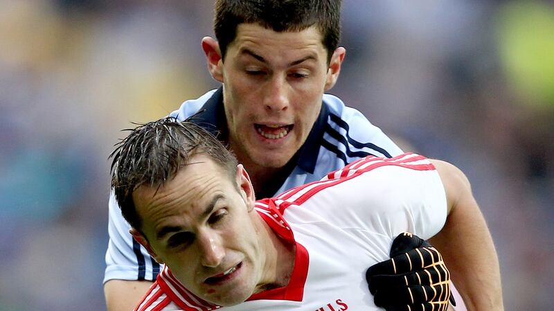 Dublin’s Ross O’Carroll challenges Mark Donnelly of Tyrone during the 2011 All-Ireland SFC quarter-final at Croke Park. Photograph:James Crombie/Inpho