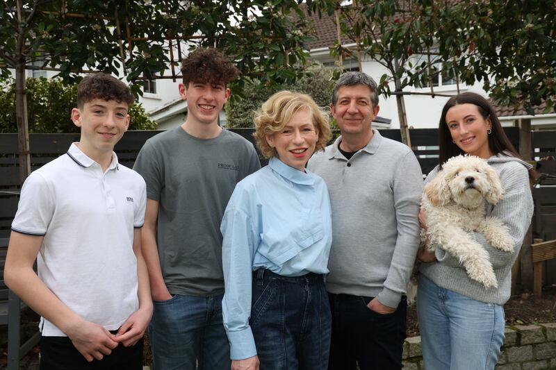 Fiona O'Flynn and Andrew Robertson with their children (from left) Rian, Finn and Eve holding 'Lennie'.  Photo: Nick Bradshaw for The Irish Times