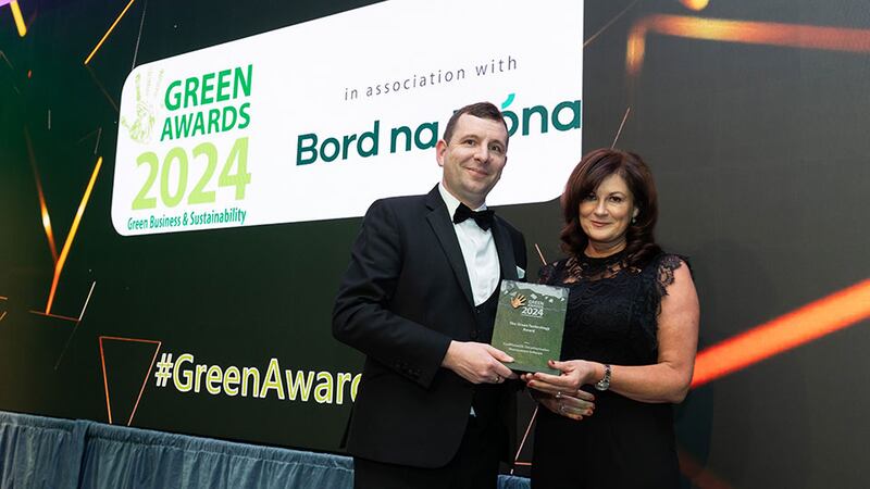 Matt Mooney, dispatch manager from Codex, presents the green technology award to Rita Lalor, CoolPlanetOS