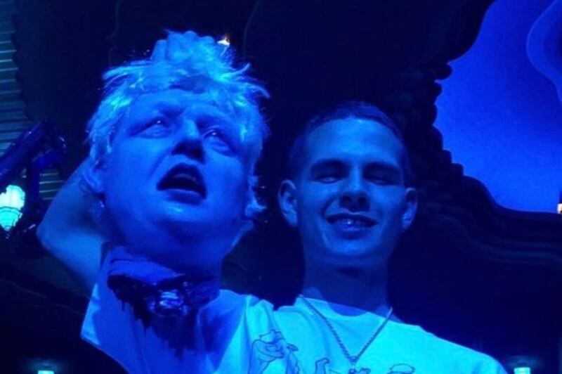 Rapper Slowthai brandishes an  effigy of British prime minister Boris Johnson