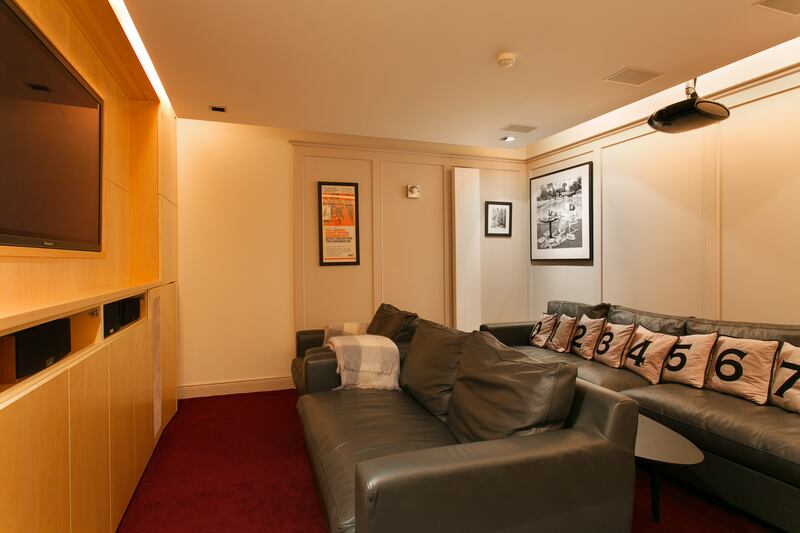 Cinema room is sound-proofed and has a screen that descends from the ceiling
