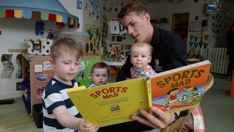 David Kenna, junior manager at the Park Academy Childcare, with Esme and Bobby Smith and Dara Corduff. Photograph: Cyril Byrne