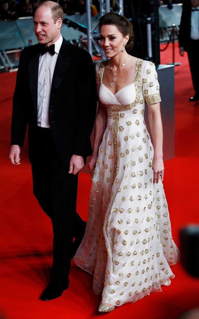 Prince William and  Duchess of Cambridge Kate Midleton in an  Alexander McQueen gown that she first wore for the royal tour of southeast Asia and the south Pacific in 2012. Photograph: Henry Nicholls/Reuters
