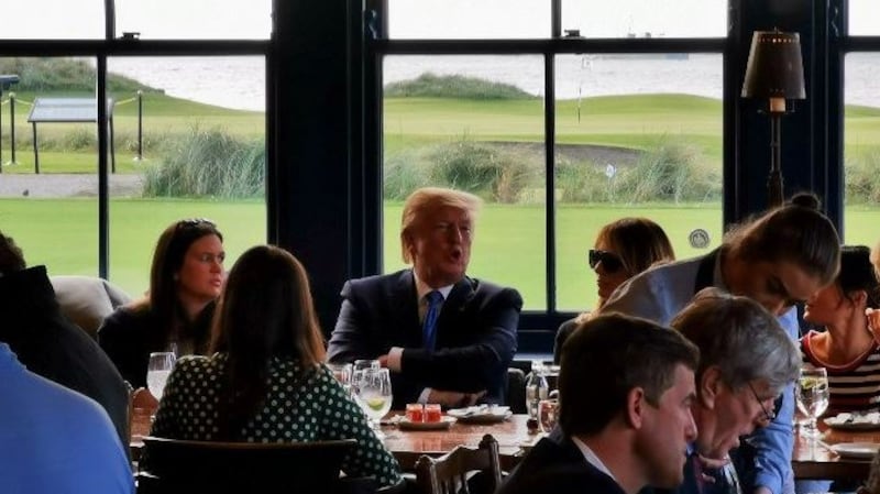US president Donald Trump  seated beside his wife Melania and White House press secretary Sarah Huckabee Sanders  in the restaurant at his hotel and golf resort in Doonbeg on Thursday evening.   Photograph: Stephen Kearon