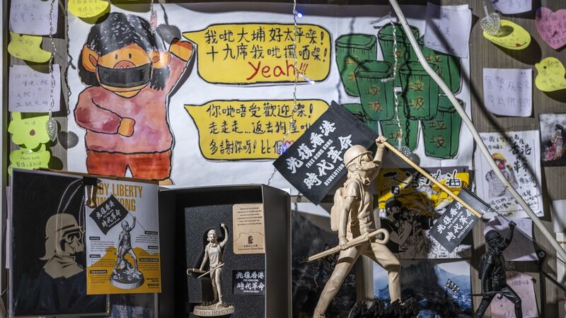 Miniature copies of the Lady Liberty Hong Kong statue are displayed for sale at a restaurant in Hong Kong. Photograph: Justin Chin/Bloomberg