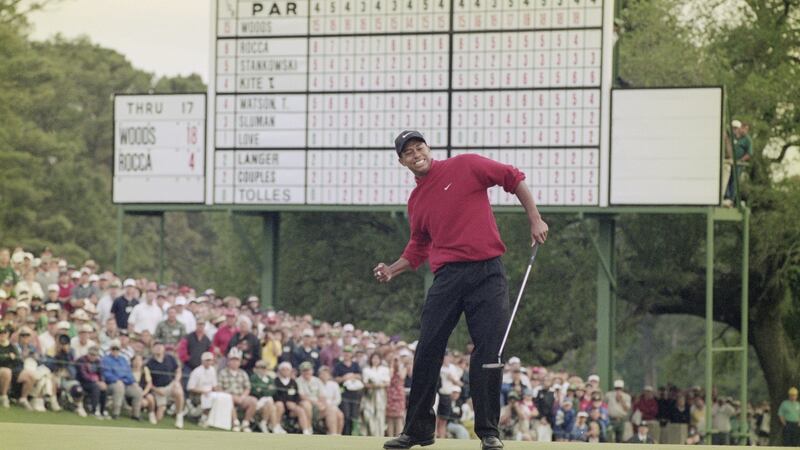 Tiger Woods celebrates his first Masters win in 1997 after sinking a four-foot putt  to win the tournament with a record low score of 18 under par. Photograph: Stephen Munday/Allsport/Getty Images