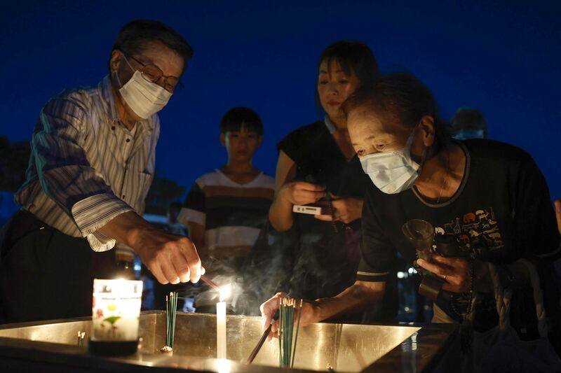 Incense was lit and hundreds of white doves, considered symbols of peace, were released. Photograph: Kyodo News/AP