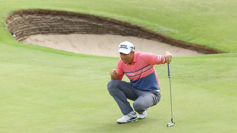 Pádraig Harrington  lines up a putt on the sixth  green during the second round. Photograph:  Andrew Redington/Getty Images