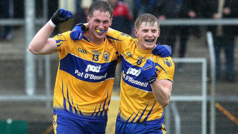 Eoin Cleary and Podge Collins celebrate Clare’s football qualifier victory over Laois at Cusack Park, Ennis. Photograph: Lorraine O’Sullivan/Inpho
