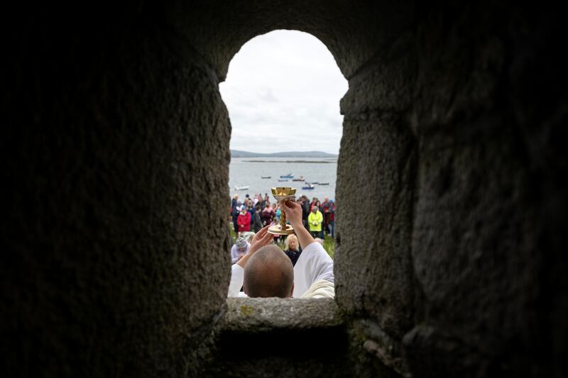 Fr Shane Sullivan, parish priest from Carna, Co Galway, celebrates mass on St MacDara’s Island for the festival. Photograph: Chris Maddaloni