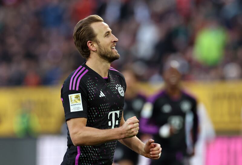 Harry Kane of Bayern Munich celebrates scoring his team's third goal during the Bundesliga match against FC Augsburg at WWK-Arena in Augsburg, Germany. Photograph: Alexander Hassenstein/Getty Images