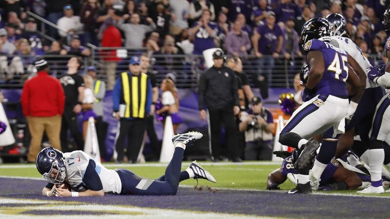 Tennessee Titans quarterback Ryan Tannehill dives for a touchdown against the Baltimore Ravens. Photograph: Shawn Thew/EPA