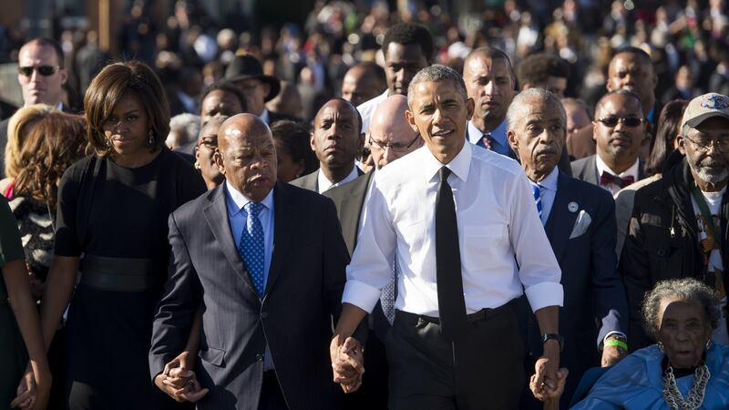 President Barack Obama walks alongside Amelia Boynton Robinson (R), one of the original marchers, the Reverend Al Sharpton (2nd R), First Lady Michelle Obama (L), and  John Lewis (2nd-L),  also one of the original marchers, across the Edmund Pettus Bridge to mark the 50th Anniversary of the Selma to Montgomery civil rights marches in Selma, Alabama in 2015. File photograph: Saul Loeb/AFP
