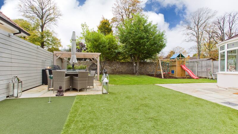 Back garden with patio, barbecue and play area