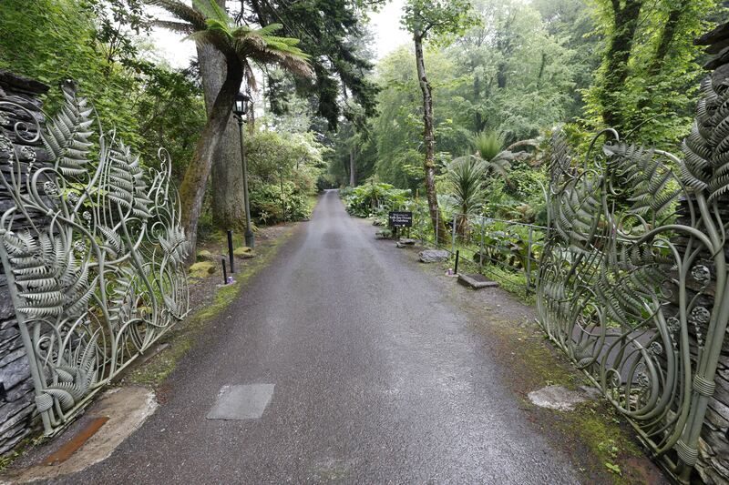 The set of hand-forged gates, ornately decorated with galvanised fern leaves that creep up their posts, at the entrance to Kell's Bay House and Gardens.