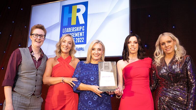 Dr. Sinéad Brennan, awards judge, presents the Overall Excellence in HR award to Obelisk team.