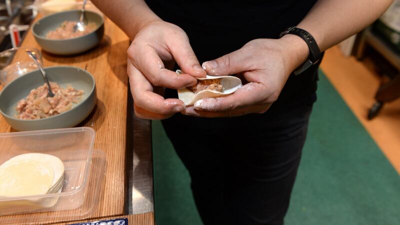 Kwanghi Chan making Pot Sticker dumplings at his Marlborough Street restaurant. Photograph: Dara Mac Dónaill