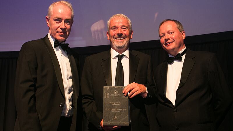 Liam Brew, Operations Director, Actavo presents the Building of the Year – Educational Award to Peter Minnis and Michael Burns TODD Architects.