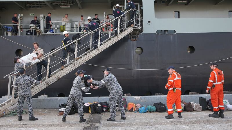 vacuees from Mallacoota arrive on the navy ship MV Sycamore at the port of Hastings. Photograph: Ian Currie/EPA