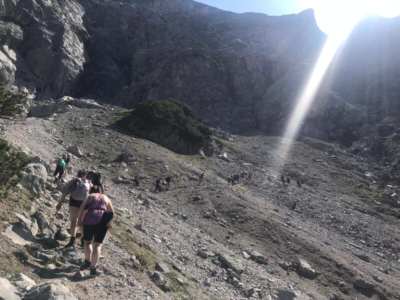 Hiking along the scree area on the Alps.