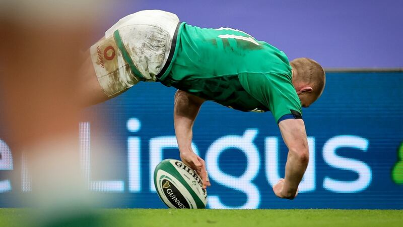 Keith Earls dives to score one of his brace of tries against Scotland. Photograph: Gary Carr/Inpho