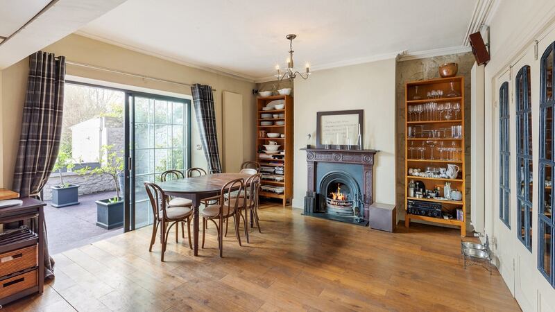 The diningroom has sliding doors that open out to the southwest-facing back