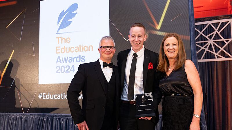 Tomas Finneran, awards judge, presents the best further education provider award to Shane Williams and Orla Morrissey, Drogheda Institute of Further Education