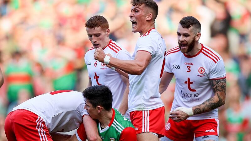 Tyrone’s Conn Kilpatrick celebrates a turnover. Photo: Tommy Dickson/Inpho