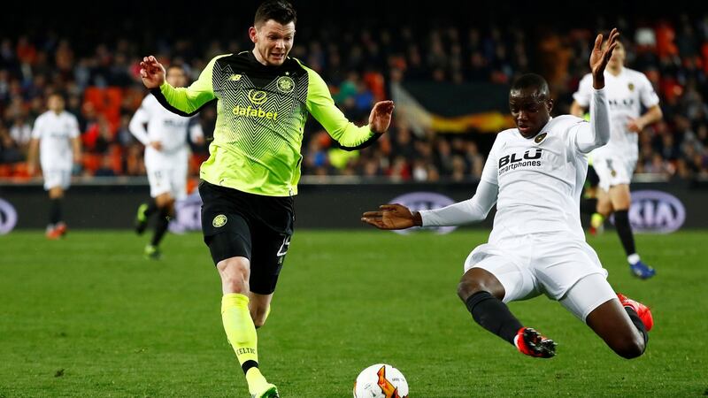 Valencia’s Mouctar Diakhaby challenges Celtic’s Oliver Burke during the Europa League round of 32 second leg at the Mestalla. Photograph:  Juan Medina/Reuters
