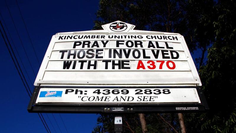 A sign displays a message on the search for  missing Malaysian Airlines Flight MH370 outside the Uniting Church in the town of Kincumber on the central Coast of New South Wales, near Sydney, Australia, today.  Photograph: David Gray/Reuters