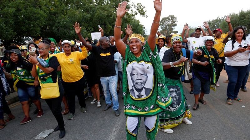 Supporters celebrate Cyril Ramaphosa being elected president of the ANC,  at the gates of the Nasrec Expo Centre in Johannesburg. Photograph: Rogan Ward/Reuters