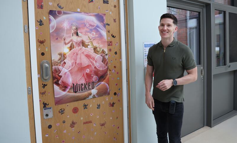 Oisin Mulchrone, deputy social care manager, at the sticker-festooned door of a service user's bedroom at Crannóg Nua. Photograph: Bryan O’Brien