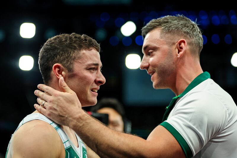 Ireland’s Rhys McClenaghan celerbates after winning gold with coach Luke Carson. Photograph: James Crombie/Inpho 