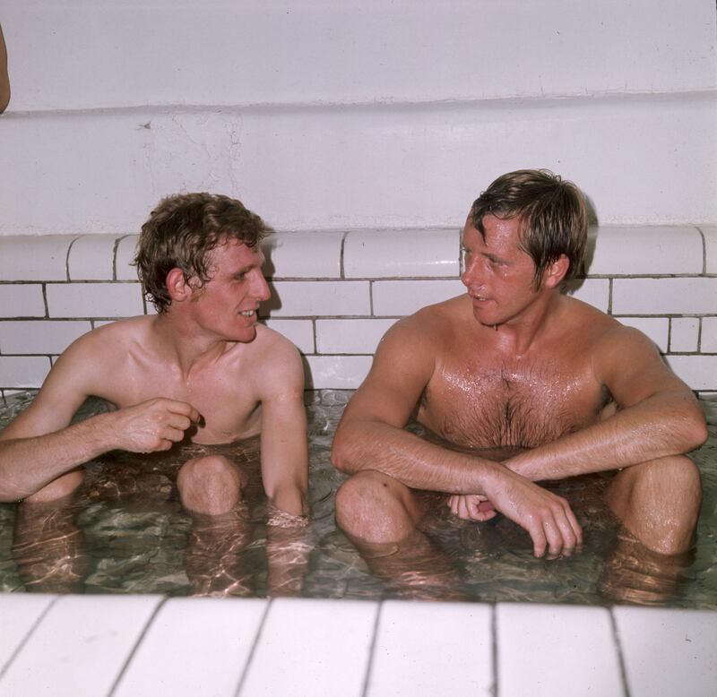 Millwall footballers Eamon Dunphy (left) and Harry Cripps after a match, circa 1970.  Photograph: Express/Express/Getty