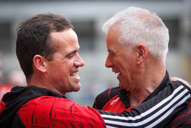 Louth manager Ger Brennan celebrates the Leinster SFC final victory against Meath with team videographer Shane Cunningham. Photograph: Tom Maher/Inpho