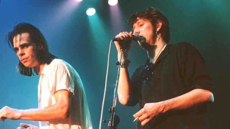 Nick Cave on stage with Shane MacGowan in London, 1992. Photograph: Redferns