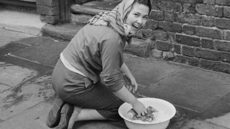 Will washing your door step  be consigned to the history book of old-fashioned chores that nobody save older generations and German housewives wants to do any more? Photograph:  Getty Images
