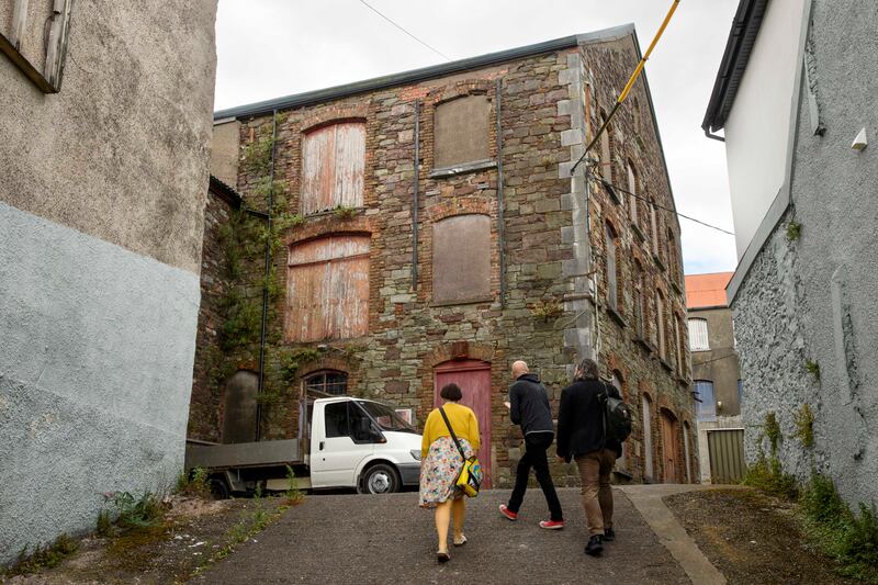 Jude Sherry, Frank O'Connor and Patrick Freyne at a derelict warehouse off Blarney street, Cork city. Photograph: Daragh Mc Sweeney/Provision