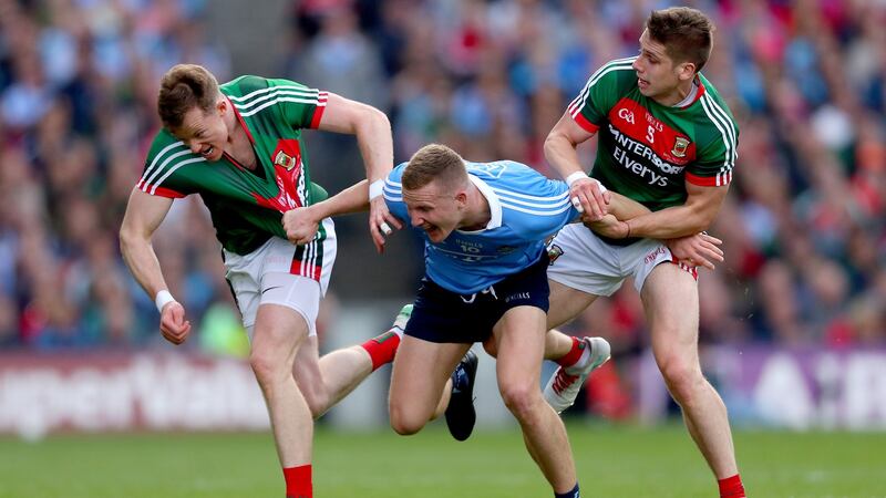 Ciaran Kilkenny battles with Donal Vaughan and Lee Keegan during the 2017 final. Photo: James Crombie/Inpho